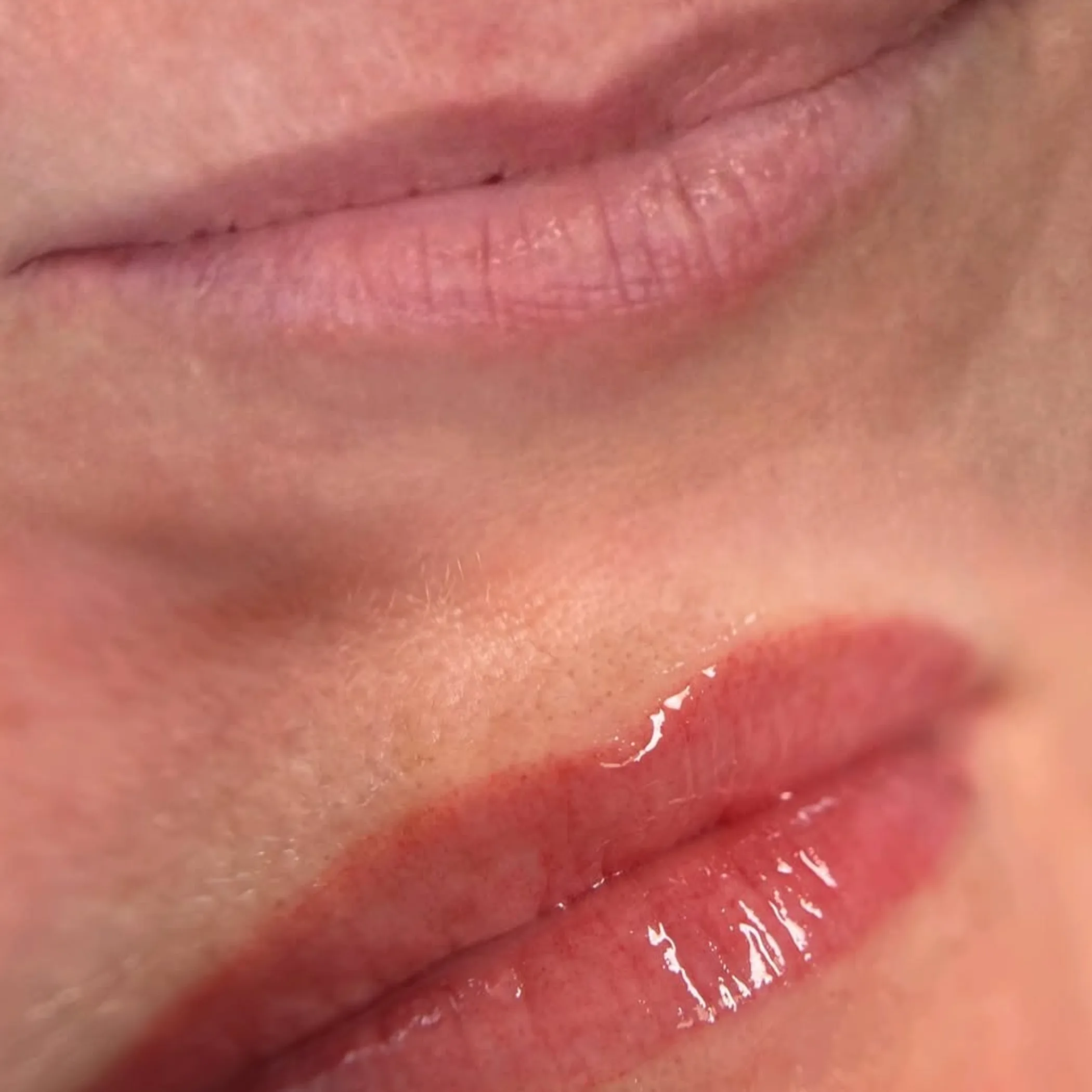 close-up of lips with lip blush tattoo