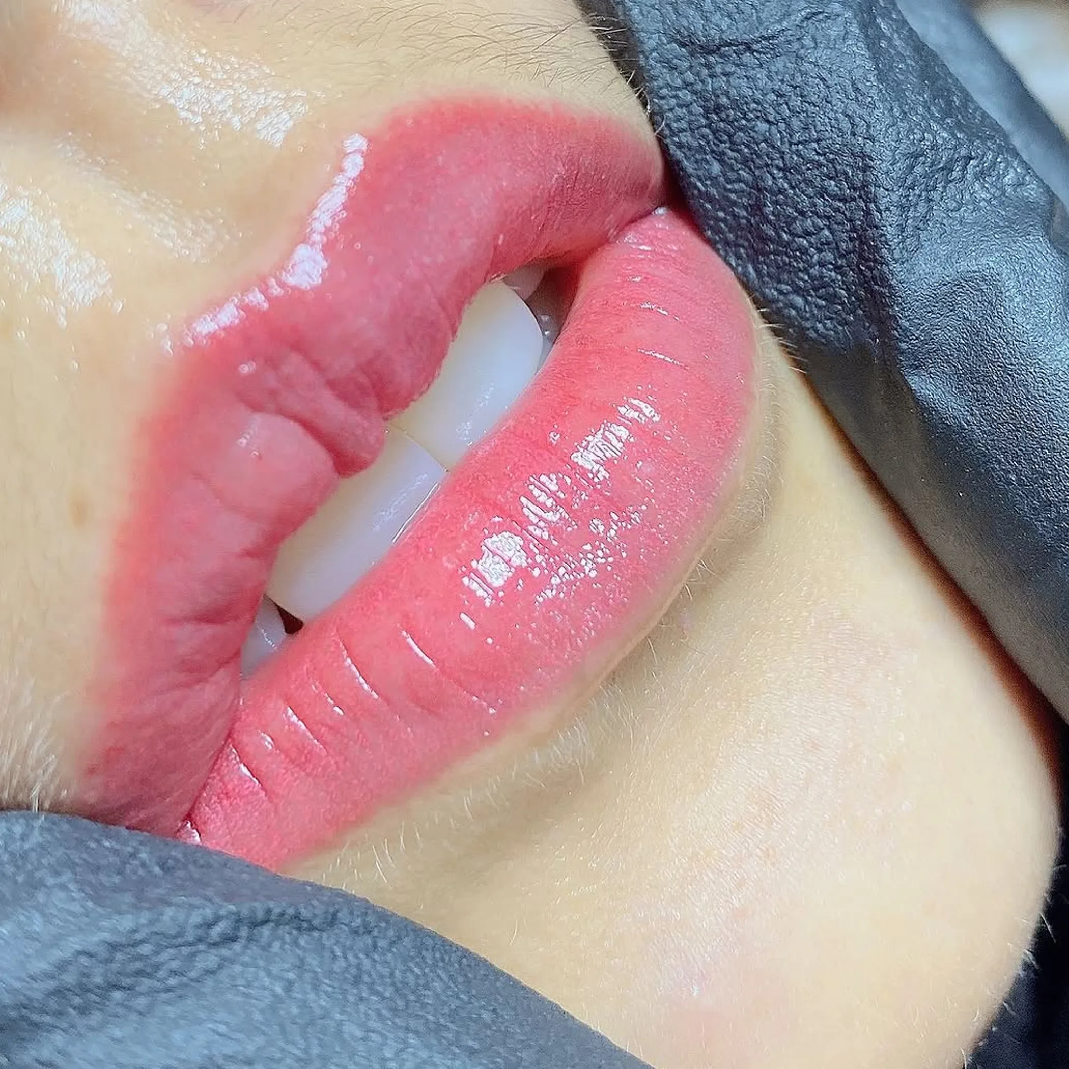 close-up of lips with lip blush tattoo
